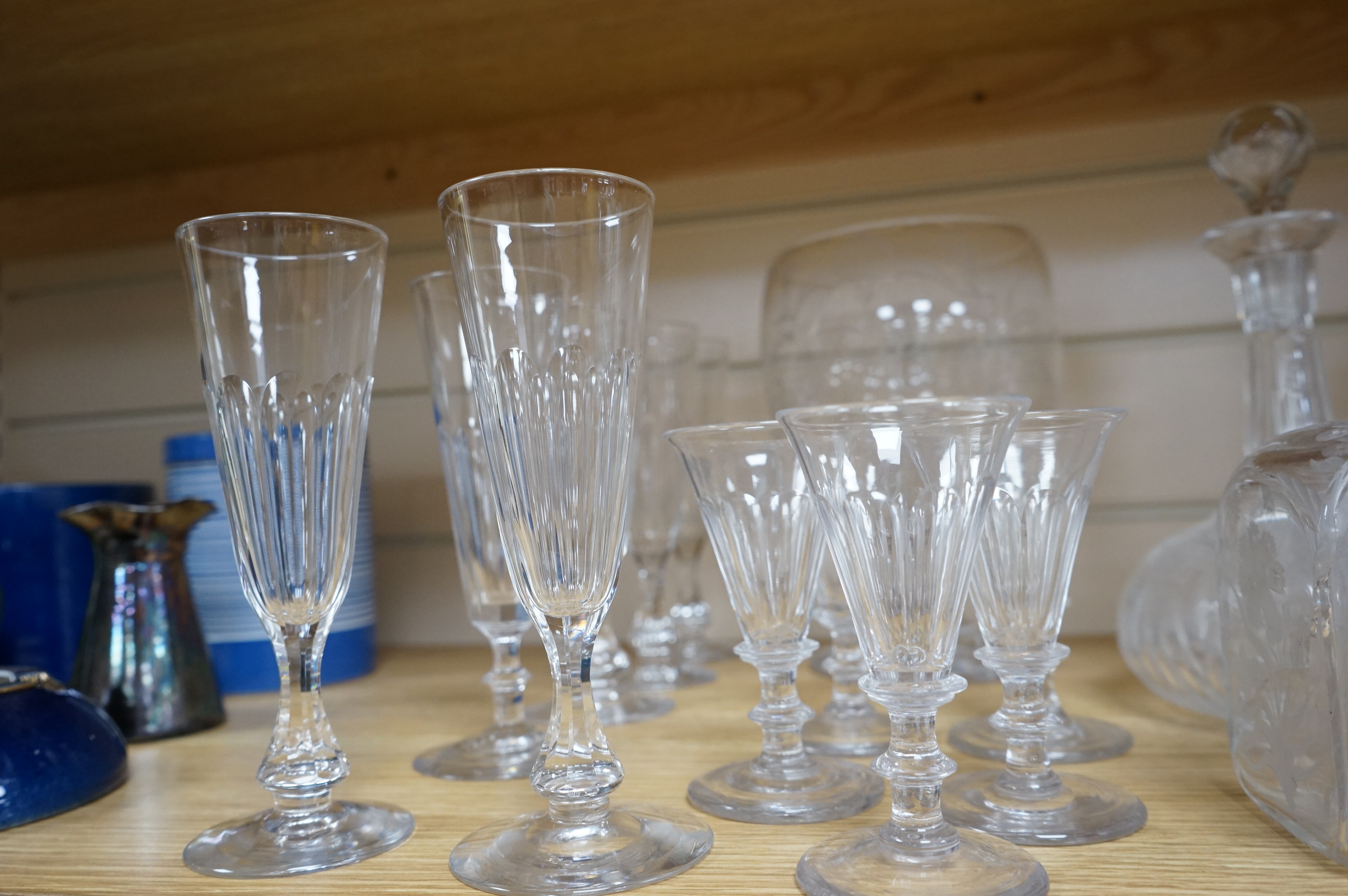 A collection of assorted drinking glassware including sets of decanters and a large etched glass goblet, largest 27cm high